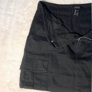 Forever 21 - Small Black jean mini skirt. With cargo pockets.